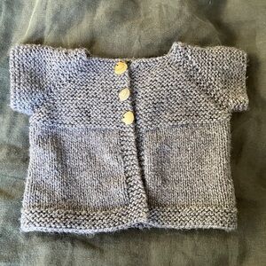Hand-made Baby sweater with shell buttons